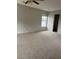 Spacious bedroom features plush carpet, ceiling fan, and a window providing plenty of natural light at 113 Lebsl Ct, Summerville, SC 29483