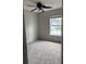 Cozy bedroom showcasing plush carpeting, a ceiling fan, and a window offering a bright view at 113 Lebsl Ct, Summerville, SC 29483