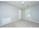 Neutral bedroom includes a built-in storage area and window at 113 Lebsl Ct, Summerville, SC 29483