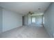 Spacious bedroom featuring neutral walls, carpet, ceiling fan, and closet at 113 Lebsl Ct, Summerville, SC 29483
