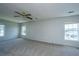Large bedroom with neutral walls and carpet with windows providing ample light at 113 Lebsl Ct, Summerville, SC 29483