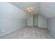 Carpeted bonus room with sloped ceiling and decorative chandelier at 113 Lebsl Ct, Summerville, SC 29483
