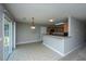 Bright kitchen with light wood cabinets, modern appliances, and a breakfast bar that opens to the dining area at 113 Lebsl Ct, Summerville, SC 29483