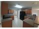 Well-lit kitchen featuring ample wood cabinets, stainless steel appliances and a breakfast bar at 113 Lebsl Ct, Summerville, SC 29483