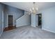 Inviting living room offers staircase access and neutral tones and flooring at 113 Lebsl Ct, Summerville, SC 29483