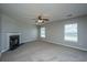 Cozy living room features a fireplace, neutral colors, and bright windows at 113 Lebsl Ct, Summerville, SC 29483