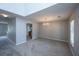 Spacious living room with large windows, carpet flooring, and updated lighting at 113 Lebsl Ct, Summerville, SC 29483