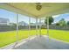 Covered and screened patio providing a nice view of the spacious backyard at 113 Lebsl Ct, Summerville, SC 29483