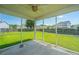Covered and screened patio providing a view of the backyard and neighborhood at 113 Lebsl Ct, Summerville, SC 29483