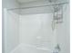 All-white tiled shower and bathtub with shower caddy and shower head at 113 Lebsl Ct, Summerville, SC 29483