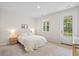 Bright bedroom features a soft color palette, plush carpet, and access to a private balcony at 113 Osprey Ridge Ln, Summerville, SC 29483