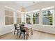 This sun-filled dining area features natural light, a modern light fixture, and views of the yard at 113 Osprey Ridge Ln, Summerville, SC 29483