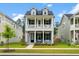 Charming two-story home with a welcoming porch and a beautifully landscaped front yard at 113 Osprey Ridge Ln, Summerville, SC 29483
