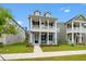 Attractive two-story home with a classic design, showcasing a spacious porch and manicured lawn at 113 Osprey Ridge Ln, Summerville, SC 29483