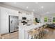 Modern kitchen featuring white cabinets, stainless steel appliances, and a large center island with seating at 113 Osprey Ridge Ln, Summerville, SC 29483