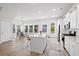 Open-concept kitchen with a center island, flowing seamlessly into the dining and living areas at 113 Osprey Ridge Ln, Summerville, SC 29483
