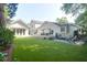 Expansive backyard showcasing a well-manicured lawn, multiple buildings, and a spacious deck with outdoor seating at 1151 Camellia Dr, Mount Pleasant, SC 29464