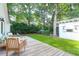 Backyard with wooden deck, artificial grass, and string lights for cozy outdoor space at 1151 Camellia Dr, Mount Pleasant, SC 29464