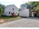 Wide backyard shot featuring playground, driveway, and detached barn at 1151 Camellia Dr, Mount Pleasant, SC 29464