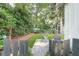 Secluded backyard featuring lush greenery, a well-maintained lawn, and inviting patio furniture at 1151 Camellia Dr, Mount Pleasant, SC 29464