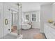 Luxurious bathroom with a walk-in shower, freestanding tub, and dual sink vanity at 1151 Camellia Dr, Mount Pleasant, SC 29464