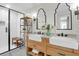 Modern bathroom featuring double sink vanity, stylish mirrors, and a glass-enclosed shower at 1151 Camellia Dr, Mount Pleasant, SC 29464