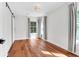 Light-filled bedroom with hardwood floors, sliding door, and large windows at 1151 Camellia Dr, Mount Pleasant, SC 29464