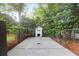 Charming dog house with classic design, situated in a well-maintained, fenced backyard at 1151 Camellia Dr, Mount Pleasant, SC 29464