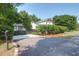 Exterior view of the charming home with well-maintained landscaping and an inviting driveway at 1151 Camellia Dr, Mount Pleasant, SC 29464