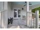 Charming front porch with seating, featuring a light blue ceiling and inviting french doors at 1151 Camellia Dr, Mount Pleasant, SC 29464