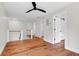 Hallway with hardwood floors and white walls leading to other rooms and stairs at 1151 Camellia Dr, Mount Pleasant, SC 29464