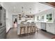 Modern kitchen with white cabinetry, stainless steel appliances, a center island, and stylish pendant lighting at 1151 Camellia Dr, Mount Pleasant, SC 29464