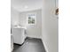 Functional laundry room equipped with modern appliances and black tile flooring at 1151 Camellia Dr, Mount Pleasant, SC 29464