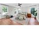 Bright main bedroom with hardwood floors, a ceiling fan, and large windows with backyard views at 1151 Camellia Dr, Mount Pleasant, SC 29464