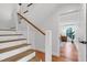 Modern staircase with a cable railing system leading to the second floor at 1151 Camellia Dr, Mount Pleasant, SC 29464