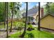 Backyard featuring a sunroom, patio seating area, and a lush, green lawn at 127 White Pine Way, Summerville, SC 29485