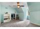 Bright bedroom with built-in storage, a ceiling fan, and a view of the trees outside the window at 127 White Pine Way, Summerville, SC 29485