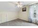 Bright bedroom featuring soft carpet, and a large window with privacy curtains at 127 White Pine Way, Summerville, SC 29485