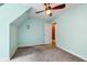 Bedroom with light blue walls, ceiling fan, and a connecting doorway to another room with a red accent wall at 127 White Pine Way, Summerville, SC 29485