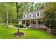 Eye-catching exterior with dormer windows, shutters, and an appealing front porch at 127 White Pine Way, Summerville, SC 29485