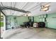 Spacious two-car garage with built-in storage shelves and organized space for tools and equipment at 127 White Pine Way, Summerville, SC 29485