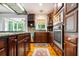 Well-equipped kitchen with stainless steel appliances, custom cabinetry, and an open view to sunroom at 127 White Pine Way, Summerville, SC 29485