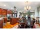 Open-concept kitchen with granite countertops, stainless steel appliances and views to the dining room at 127 White Pine Way, Summerville, SC 29485