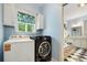 Convenient laundry room located near Primary bathroom at 127 White Pine Way, Summerville, SC 29485