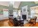 Elegant living room featuring high ceilings, fireplace, and lots of natural light at 127 White Pine Way, Summerville, SC 29485