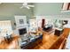 Spacious living room with hardwood floors, fireplace, and views to dining area at 127 White Pine Way, Summerville, SC 29485