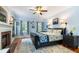 Serene bedroom with fireplace, king bed, and blue accents at 127 White Pine Way, Summerville, SC 29485