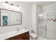 This bathroom features a single sink, a large mirror, and a shower with a glass door at 130 River Landing Dr # 8203, Charleston, SC 29492
