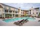 Scenic community pool surrounded by multiple-dwelling units, providing a refreshing oasis for residents at 130 River Landing Dr # 8203, Charleston, SC 29492