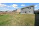 Lush backyard featuring green grass and a wooden privacy fence at 1309 Berry Grove Dr, Summerville, SC 29485